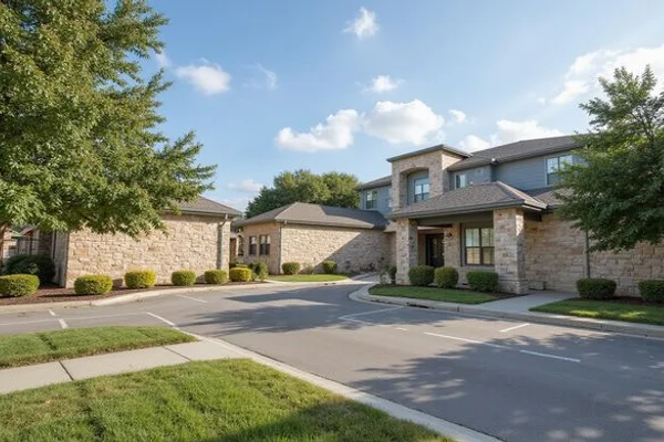 Freshly landscaped entry drive of a new apartment community